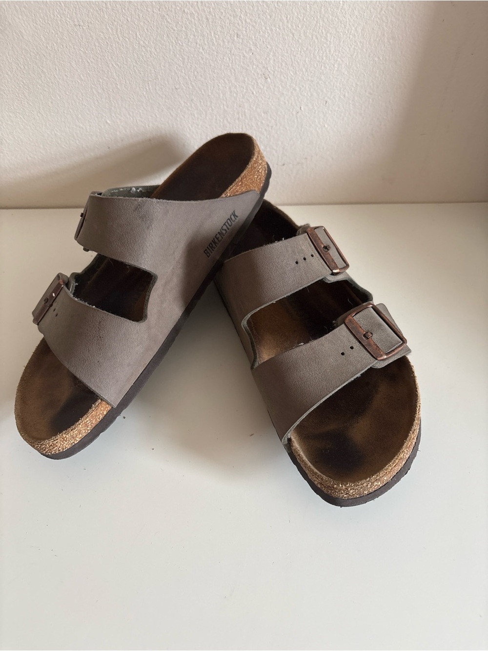 Birkenstock Arizona sandals in a brown or mocha shade, featuring a classic doubl
